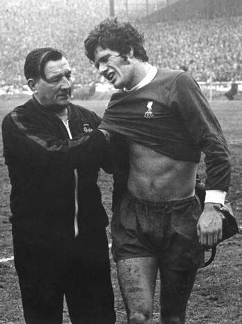 Paisley in his role as physio attending to Phil Boersma on 12th September 1970